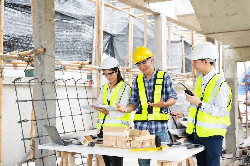 Engineers reviewing plans