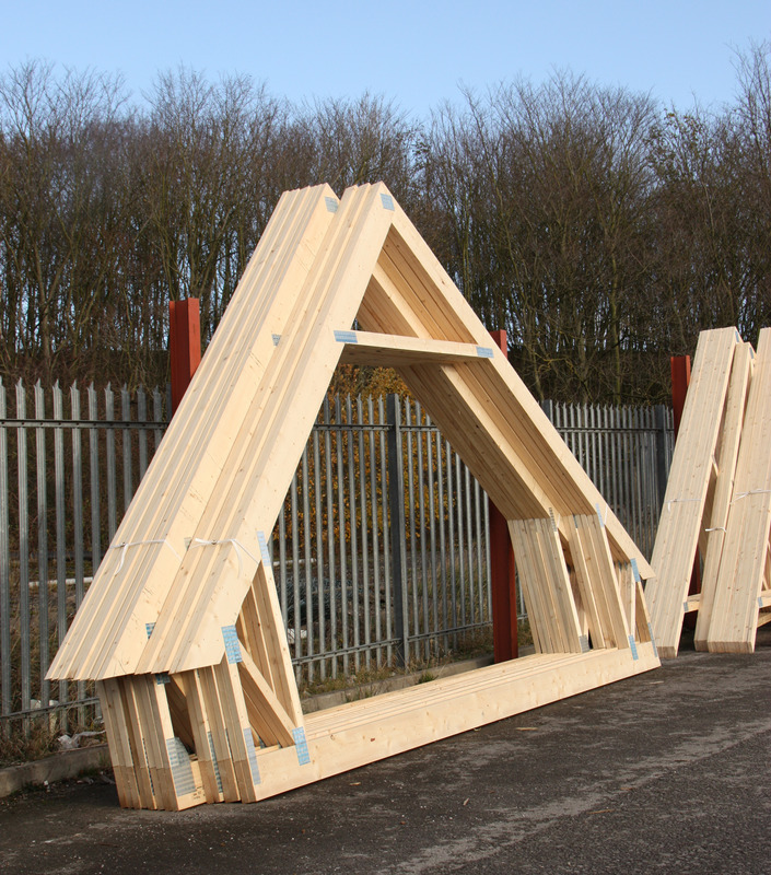 Stacked roof trusses ready for installation
